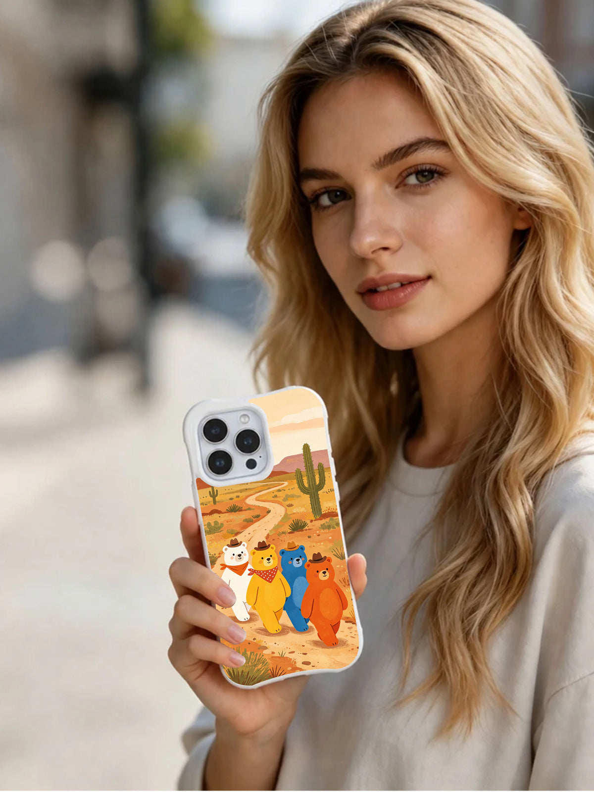Person holding Western Trail Bears iPhone 14 Pro Max case