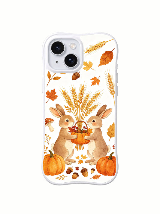Wheat Field Bunny Thanks: İki açık kahverengi tavşan uzun buğday demetinin altında bal kabağı biçimli sepeti paylaşıyor; ayaklarının yanında bal kabakları var.