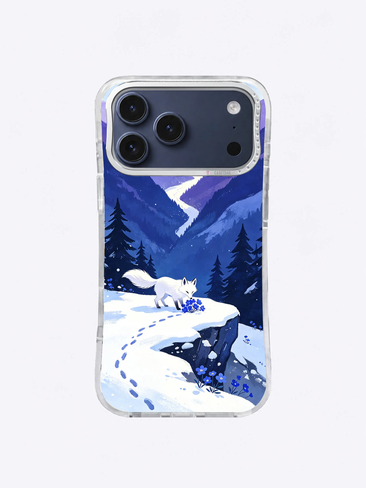 Blue flowers rooted beside a white fox in a winter valley on an iPhone case