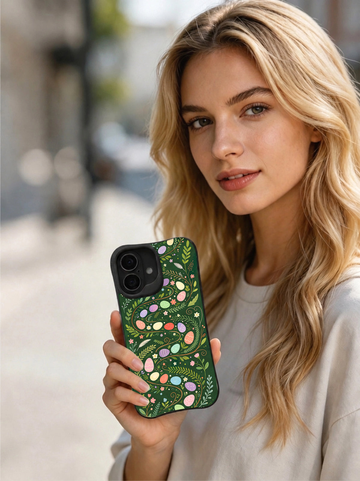 Wild Bunny Trail: Person holding the illustrated case in an outdoor portrait.