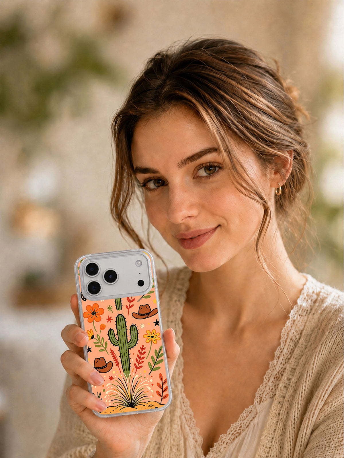 Wild West Flower Ranch iPhone 17 Pro Max case held in hand
