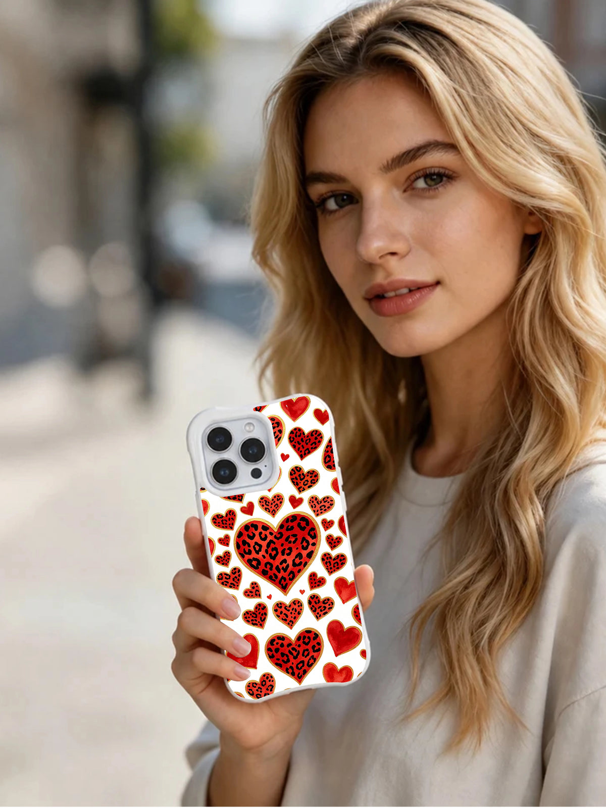 Wildflower Promise leopard heart iPhone 16 Pro case in hand