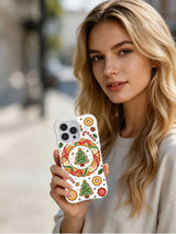 Winter Bakery Wishes iPhone 13 Pro case held in hand
