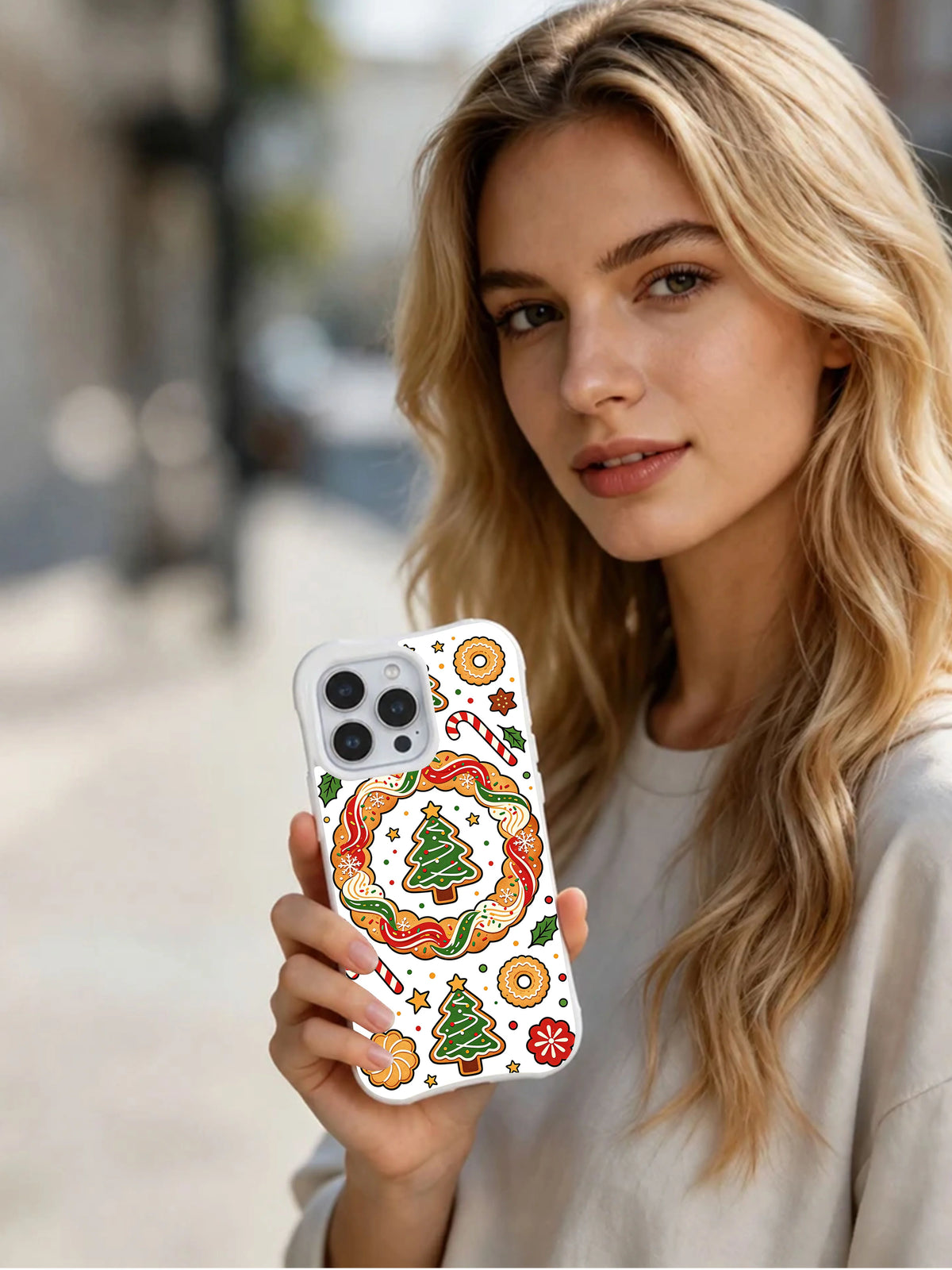 Winter Bakery Wishes iPhone 13 Pro case held in hand