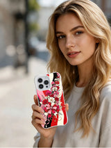 Lifestyle view of a person holding the Holiday Bow Bouquet iPhone 14 Pro case