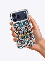 Winter Butterfly Conservatory iPhone 17 Pro Max case held in hand