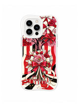 Winter Gift Bow Garden pattern on a white iPhone 14 Pro case with clustered pink bow flowers, red ribbons, wrapped gifts, black ink marks and ivory brushwork