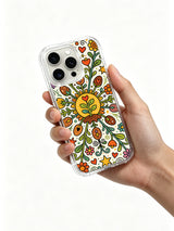 Wonder Seed Garden iPhone 14 Pro case held in hand