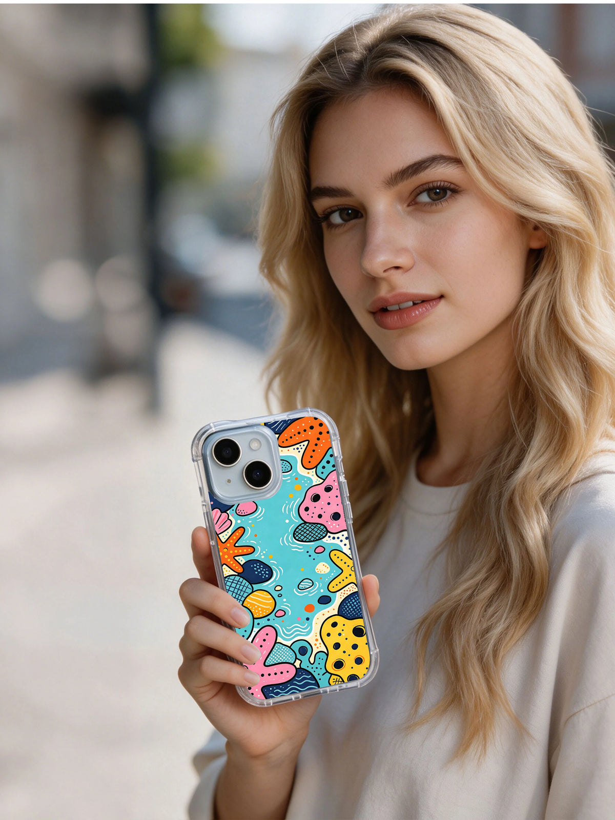 Tidepool Carnival colorful coastal phone case in hand